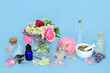 Homeopathic flowers and herbs used in natural herbal medicine. Preparation of medicinal sedative flora food ingredients on blue.