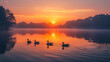 A tranquil lake shrouded in morning mist, illuminated by the first light of dawn, adorned with graceful ducks gliding through the serene waters