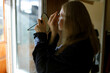 © Olga Murzaeva/Stocksy - the woman makes herself a make-up