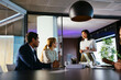 © BONNINSTUDIO/Stocksy - Financial advisors having a meeting in office