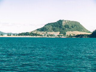 Canvas Print - Mount Maunganui landmark beyond blue sea