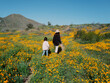 © Daniel Kim Photography/Stocksy - Hiking in poppies