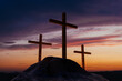 © Marcos Osorio/Stocksy - Serene Sunset Behind Three Crosses on a Hill