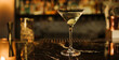 Elegant Martini Glass with Olive on a Bar Counter