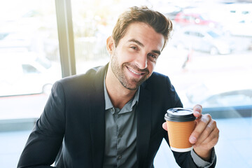 Happy, portrait and businessman with coffee for morning or start at cafe or indoor restaurant. Young man or employee with smile enjoying beverage, latte or cappuccino drink for caffeine or business