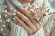 Woman, hands and flowers in closeup with nature for art, light and natural in winter. Female person and fingers with floral or plant in zoom, sustainable fashion or eco friendly and accountability