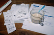 © Oleksii Syrotkin/Stocksy - Business Receipts and  coffee with milk Glass on Wooden Table