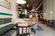 © Oleksii Syrotkin/Stocksy - Café Owner Organizing Business Documents