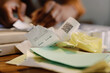 © Oleksii Syrotkin/Stocksy - Bill among papers