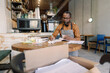 © Oleksii Syrotkin/Stocksy - Manager reviewing inventory