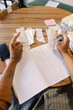 © Oleksii Syrotkin/Stocksy - Cafe owner organising finances