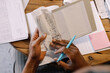 © Oleksii Syrotkin/Stocksy - Anonym doing bookkeeping