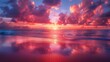 The sun sets over the ocean, painting the sky and water in pink hues of dusk