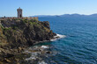 The lighthouse of Piombino, the Rocchetta in Piazza Bovio. View of the Piombino canal and the Island of Elba, Piombino, Tuscany, Italy