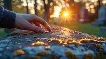 A Person Touching A Stone With Moss On It At Sunset, AI