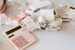 © ByLorena/Stocksy - Receipts on table