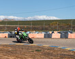 © Christine La/Stocksy - Motorcyclist on race track