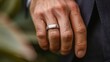 © Justlight - The weight of a mans wedding band has left a permanent mark on his finger a reminder of the commitment and love he has for his partner. .