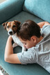 © Irina Polonina/Stocksy - Kid sleeping together with pet.