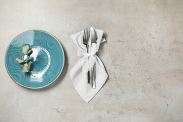 Poster - Setting with beautiful cutlery on textured table, top view. Space for text