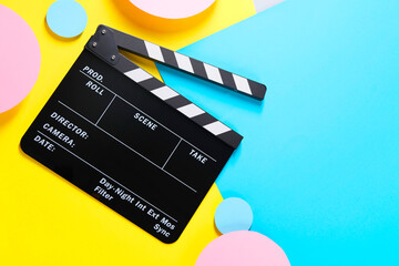 Wall Mural - Clapperboard on color background, top view. Space for text