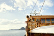© Victor Bordera/Stocksy - woman at a boat enjoying the views