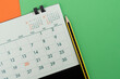 close up of calendar on the colorful table background, planning for business meeting or travel planning concept