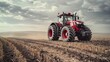 Powerful Tractor Plowing Fertile Farmland in Dramatic Countryside Landscape with Cloudy Sky