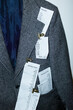 © Colour Laboratory/Stocksy - Formal business office tweed blazer with paper receipts and flashlight