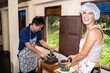 © Alvaro Lavin/Stocksy - Smiling woman in cook class.