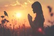 Woman praying and free the birds to nature on sunset background. Woman praying and free the birds enjoying nature on sunset background, hope concept