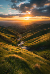 Wall Mural - Dramatic Sunset Over Lush Green Hills with River Valley