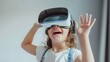 Snapshot of a young woman with vr headset executing finger gestures for touching, zooming and swiping. women embrace virtual reality or metaverse innovation for 3d simulation