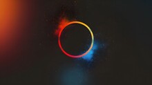 A Colorful Circle On A Dark Background. The Circle Is Red And Blue