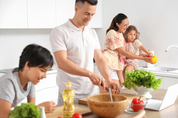 Sticker - Happy mother with her little daughter washing bell peppers in kitchen