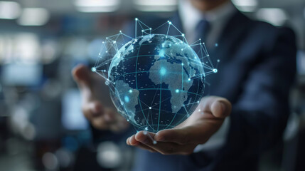 A man is holding a globe in his hand, with a blue and green design