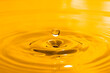 yellow drop oil , Liquid gold oil drop ripple background.