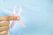 woman with Pink ribbon for patients with breast and cervical cancer