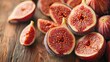   A stack of sliced figs sits atop a weathered wooden table, nearby stands a halved fig tree