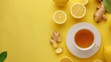 Drink Lemon Tea And Ginger On Yellow Background 