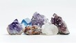 Macro mineral collection featuring amethyst, quartz, garnet, sodalite, and agate, arranged in a sleek, minimalistic composition, white isolation