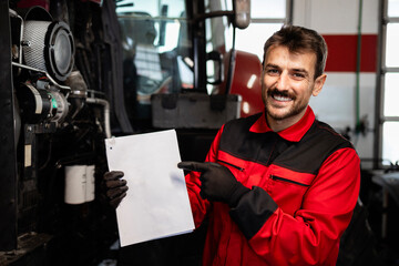 Poster - Serviceman standing by tractor and holding instruction manual of agricultural machinery.