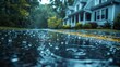 © VISUAL BACKGROUND - A rainy street with a house in the background.