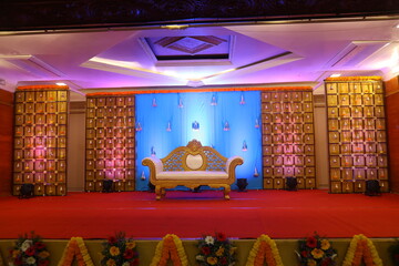 Wall Mural - stage decoration with chrome backdrop with a couch at the centre
