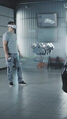 Wall Mural - car service manager assembling a car engine in a futuristic virtual reality program using a joystick