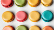 Assorted colorful macarons on white background, French patisserie