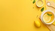 © Mikus - A yellow backdrop showcases a lemonade bowl, two lemons on a cutting board, and a wooden spoon