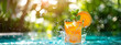 summer cocktails by the pool. sunny day, splashes, tropical fruits. Blurred background with copy space	