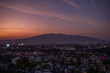 View of Doi Suthep mountain and Chiang Mai after sunset.  Thailand