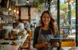 Woman Holding Tablet in Restaurant